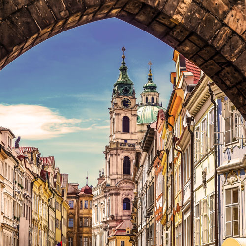 image of building looking down a street to a cathedral 